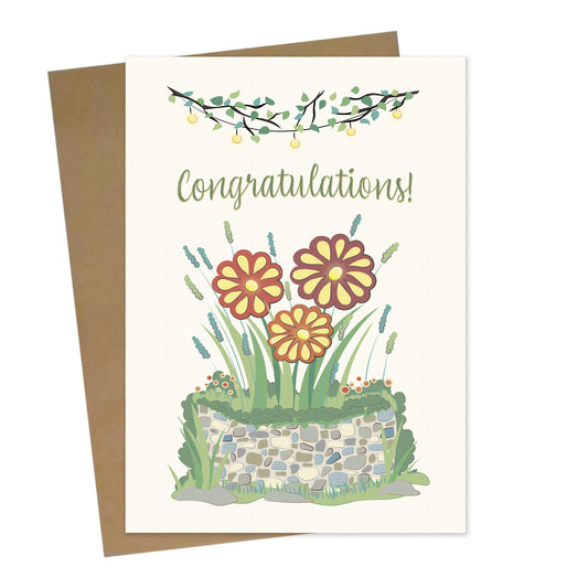 Mockup for greeting card digital design showing illustration of flowers in a flower bed greeting the morning sun below the phrase "Congratulations!"