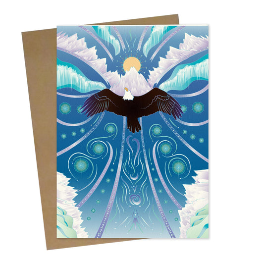 Mockup for greeting card digital design showing an imaginary illustration of an eagle in flight soaring upwards to the blue sky, which is adorned with flourishing designs and the sun behind the winter mountains