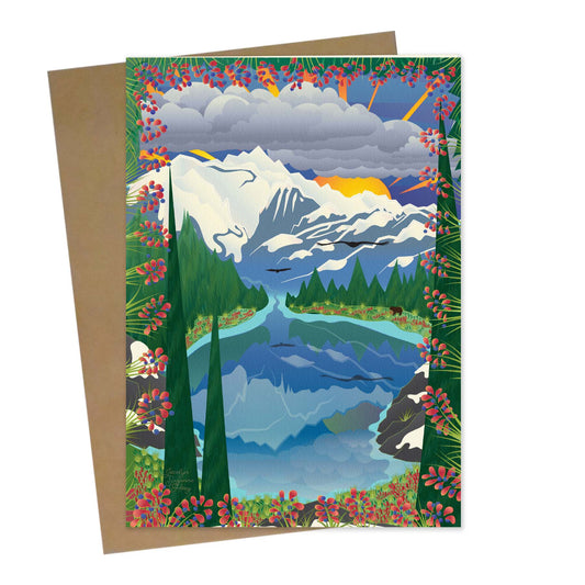 Mockup for greeting card digital design showing the view looking down from Artist Point with a reflecting pond, Mt Baker, the brilliant sun flashing it’s beams and the ever present birds in flight 