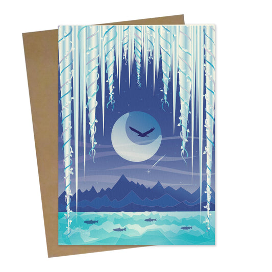 Mockup for greeting card digital design showing an eagle in flight before a backdrop of the moon at night surrounded by imaginary icicles framing the top half, while salmon swim in the river below and a shooting star is also seen in front of the mountain range