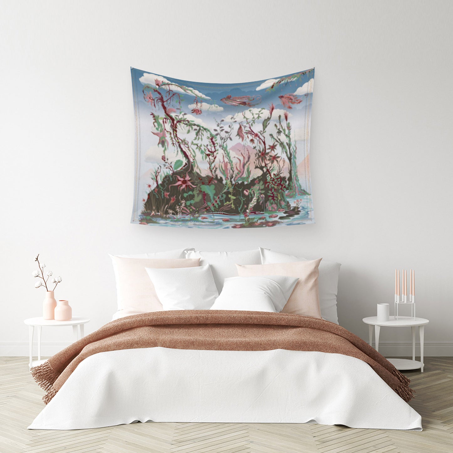 bedroom mockup for tapestry on a wall with digital design showing the hummingbird queen being followed closely by the hummingbird king over an imaginary land of plants and trees, all beneath a cloud cover, above a bed with many, many pillows and 2 blankets